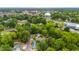 This home is surrounded by lush greenery and trees, offering a serene environment at 223 Hall Ave, Burlington, NC 27217