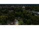 Aerial view of a home nestled among lush greenery in a vibrant neighborhood at 223 Hall Ave, Burlington, NC 27217