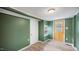 Entryway area with a wooden door, window, and light-colored floors at 223 Hall Ave, Burlington, NC 27217