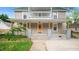 Inviting front porch with a bright yellow door, offering a warm welcome to the home at 223 Hall Ave, Burlington, NC 27217