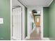 Hallway with white and yellow doors leading to various rooms, offering a glimpse into the home's layout at 223 Hall Ave, Burlington, NC 27217