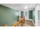 Hallway featuring railings, stairs and doors leading to other rooms at 223 Hall Ave, Burlington, NC 27217