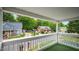 Enjoy neighborhood views from this home's covered porch with a classic white railing at 223 Hall Ave, Burlington, NC 27217