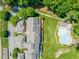 An aerial view of townhomes showcasing prime location next to pool, green space and walking trails at 2303 Upper Oaks Way, Raleigh, NC 27615