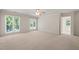 Spacious bedroom with large windows and natural lighting at 2303 Upper Oaks Way, Raleigh, NC 27615