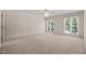 Bright and airy bedroom featuring natural light and ample space at 2303 Upper Oaks Way, Raleigh, NC 27615