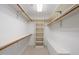 Well-organized closet with ample shelving and clothes rods for optimal storage at 2303 Upper Oaks Way, Raleigh, NC 27615
