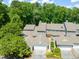 Stylish townhomes with attached garages and manicured landscaping, offering modern comfort and convenience at 2303 Upper Oaks Way, Raleigh, NC 27615