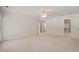 Spacious main bedroom featuring a neutral carpet, a ceiling fan and plenty of closet space at 2303 Upper Oaks Way, Raleigh, NC 27615