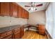 Inviting home office featuring granite countertops, wood floors, custom cabinetry, and neutral paint at 2303 Upper Oaks Way, Raleigh, NC 27615