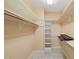 Well-organized walk-in closet with shelving and rod for ample storage at 2303 Upper Oaks Way, Raleigh, NC 27615