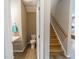 Half bath showing modern sink, toilet and stairs with wood banister at 238 Oak Meadow Ln, Angier, NC 27501