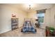 Charming bedroom with a unique car-themed bed frame, complementary decor, and a window at 238 Oak Meadow Ln, Angier, NC 27501