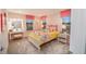 Bright bedroom with large windows, red and white checkered accents and carpet flooring at 238 Oak Meadow Ln, Angier, NC 27501