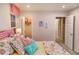 Bedroom featuring large bed with floral pattern and access to the closet at 238 Oak Meadow Ln, Angier, NC 27501