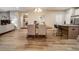 Bright dining area with a wooden table and modern chairs, seamlessly connects to the kitchen at 238 Oak Meadow Ln, Angier, NC 27501