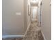 Neutral hallway with carpet and white doors at 238 Oak Meadow Ln, Angier, NC 27501