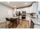 Bright kitchen with white cabinets, granite countertops, and stainless appliances at 238 Oak Meadow Ln, Angier, NC 27501