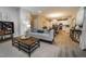 Open concept living room showcases a cozy sitting area flowing into the dining and kitchen spaces at 238 Oak Meadow Ln, Angier, NC 27501