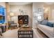 Inviting living room with neutral tones, stylish furnishings, and a decorative wine rack at 238 Oak Meadow Ln, Angier, NC 27501