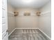 Spacious walk-in closet with carpet, wire shelving and neutral walls at 238 Oak Meadow Ln, Angier, NC 27501