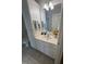 Bathroom with white vanity, framed mirror, and decorative accents at 2520-102 Gordon Glen Ct, Raleigh, NC 27617