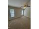 Bedroom featuring neutral walls, plush carpet, and large windows for natural light at 2520-102 Gordon Glen Ct, Raleigh, NC 27617