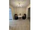 Cozy dining room with modern chandelier, seating for two at 2520-102 Gordon Glen Ct, Raleigh, NC 27617