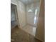 Bright foyer with neutral tile flooring and a sidelight window at 2520-102 Gordon Glen Ct, Raleigh, NC 27617