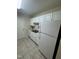 Clean kitchen with white cabinets and convenient layout at 2520-102 Gordon Glen Ct, Raleigh, NC 27617