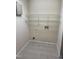 Laundry room featuring ceramic tile floor and wire shelving at 2520-102 Gordon Glen Ct, Raleigh, NC 27617