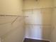 Walk-in closet with wire shelving perfect for organization and storage at 2521 Friedland Pl # 301, Raleigh, NC 27617