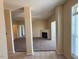 View of the living room featuring neutral tones and access to a fireplace at 2521 Friedland Pl # 301, Raleigh, NC 27617