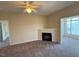 Living room featuring a ceiling fan, fireplace, and a window with a view at 2521 Friedland Pl # 301, Raleigh, NC 27617