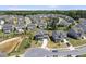 Neighborhood aerial view highlighting the home's curb appeal, pond, and surrounding residences at 2527 Sidewinder Ct, Apex, NC 27523