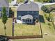 This aerial view showcases a fenced backyard with a screened porch and pristine lawn at 2527 Sidewinder Ct, Apex, NC 27523
