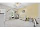 Cozy Bedroom with neutral tones, a ceiling fan, and natural light from the window at 2527 Sidewinder Ct, Apex, NC 27523