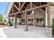 Stunning clubhouse entrance boasts stone accents, wooden beams, and inviting benches at 2527 Sidewinder Ct, Apex, NC 27523