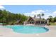 Resort-style pool offers lounge chairs, tables, and a covered area for relaxing poolside at 2527 Sidewinder Ct, Apex, NC 27523