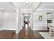 Inviting foyer with hardwood floors that opens to the living room and dining area at 2527 Sidewinder Ct, Apex, NC 27523