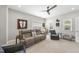 Cozy living room with a ceiling fan and comfortable seating for Gathering and guests at 2527 Sidewinder Ct, Apex, NC 27523