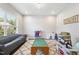 Spacious living room with a large window, plush seating, and ample space for activities at 2527 Sidewinder Ct, Apex, NC 27523