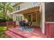 This outdoor deck includes an awning and a seating area, ideal for enjoying the backyard at 2728 Cameron Pond Dr, Cary, NC 27519