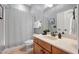 Neutral bathroom featuring a vanity, mirror, and a shower/tub combo with a striped curtain at 2728 Cameron Pond Dr, Cary, NC 27519
