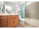 Cozy bathroom with a vanity, commode, and tub with tile surround, and a shower curtain at 2728 Cameron Pond Dr, Cary, NC 27519