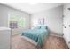 Cozy bedroom with a bright window and a comfortable blue bed at 2728 Cameron Pond Dr, Cary, NC 27519