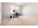 Large room with neutral carpet, large window, and desk at 2728 Cameron Pond Dr, Cary, NC 27519