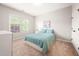Cozy bedroom with a large window and soft, neutral decor at 2728 Cameron Pond Dr, Cary, NC 27519