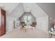 This well-lit bonus room offers a cozy sitting area with comfortable chairs and a charming coffee table at 2728 Cameron Pond Dr, Cary, NC 27519