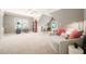 Spacious bonus room featuring neutral paint, large windows, and cozy sitting area with a ceiling fan at 2728 Cameron Pond Dr, Cary, NC 27519